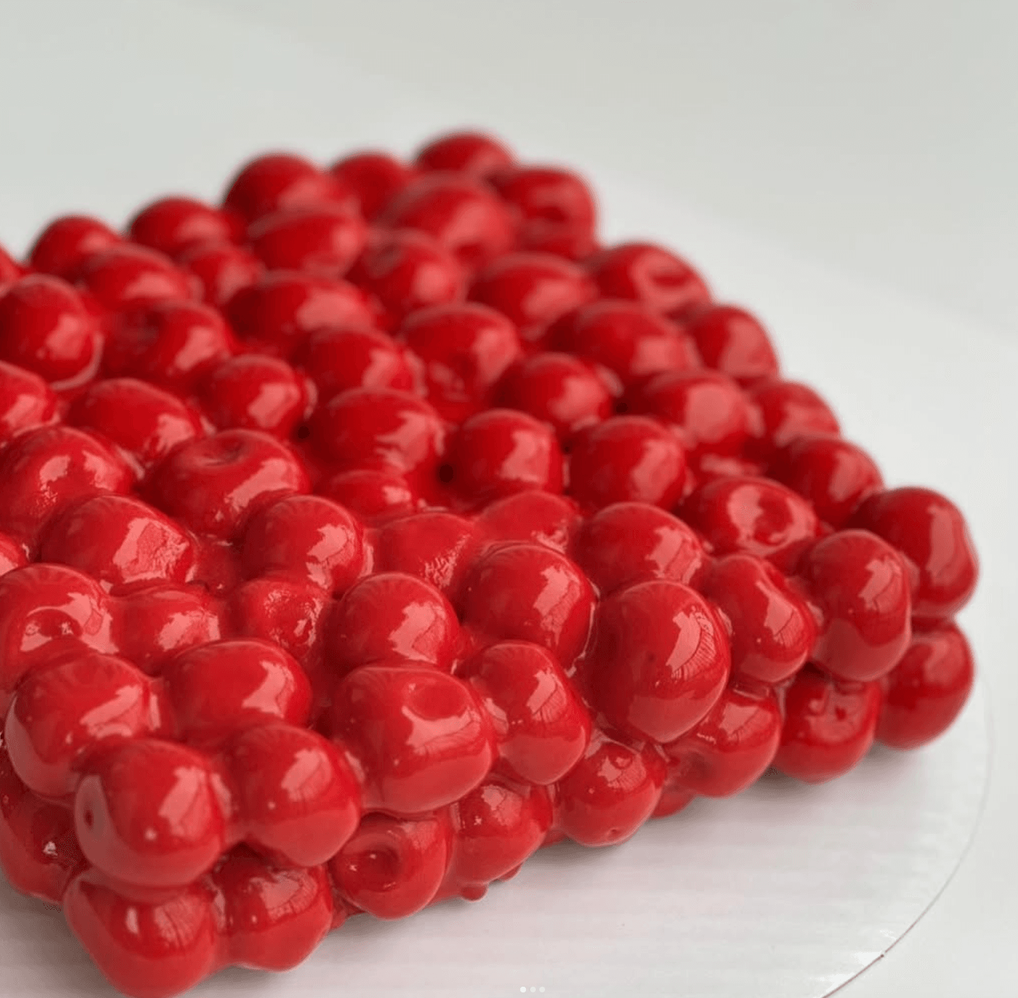 Red glossy sphere bento cake — signature textured design