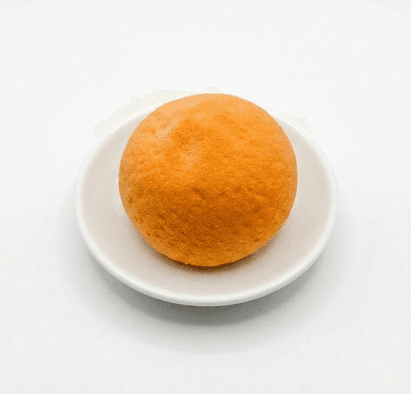 Orange dome mousse dessert — handcrafted pastry